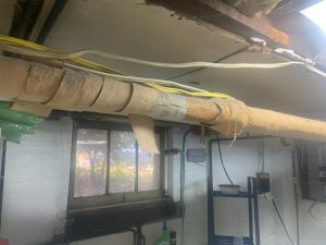 Typical Asbestos pipe wrap in home basement Toronto