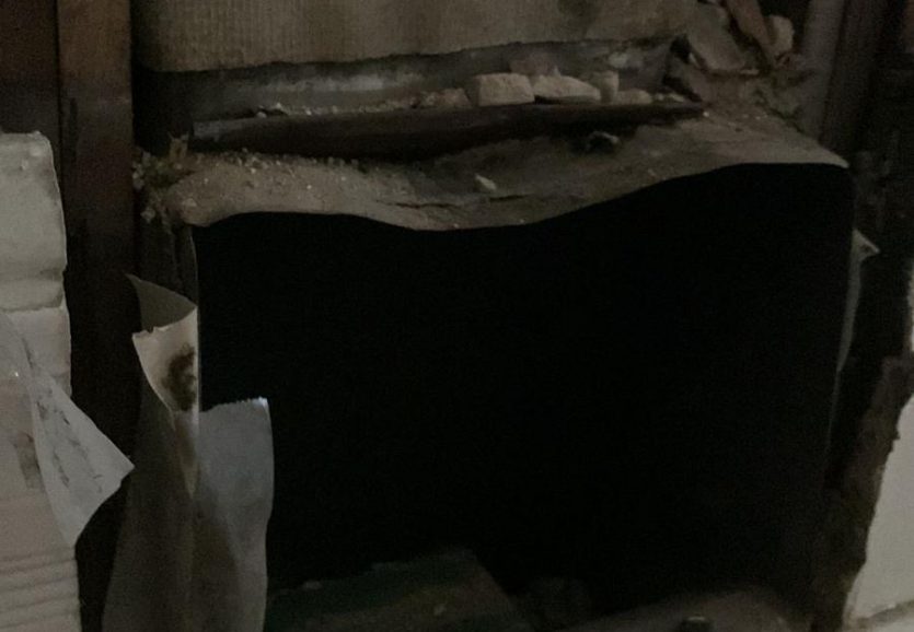 asbestos covered air duct in home